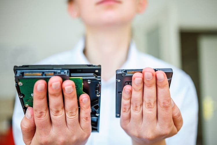SSD vs HDD in woman's hand