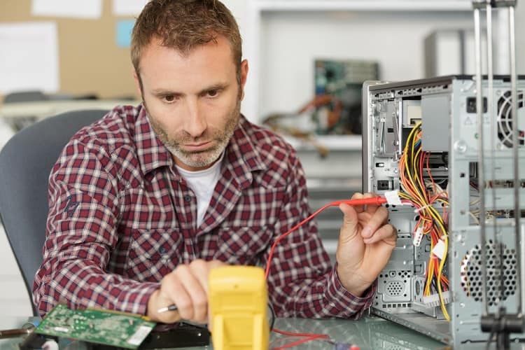 a man fixing the electronics