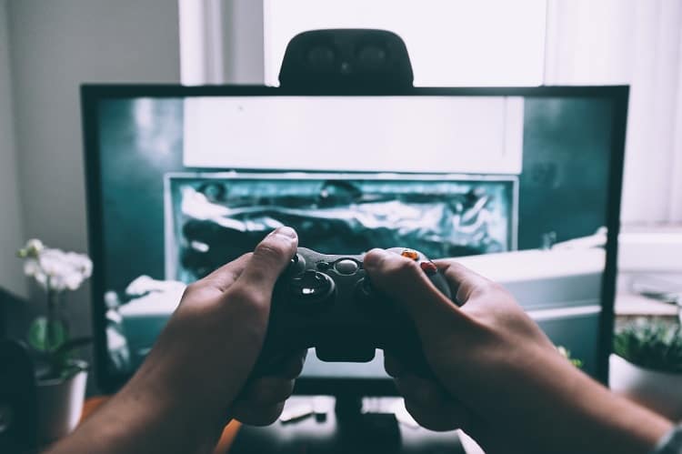 hands with joystick while playing gaming