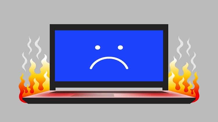 Open laptop with unhappy face icon on screen and flame